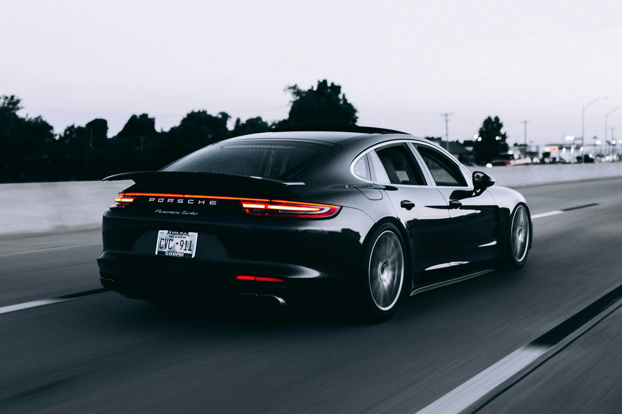 Silver sports car on a scenic coastal road